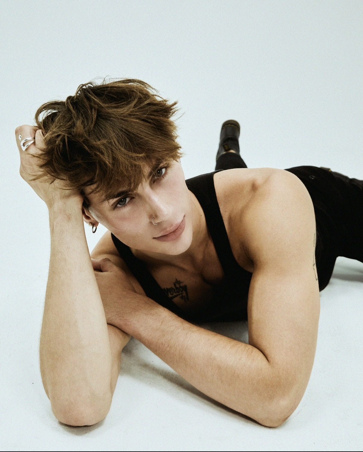 Floor pose, black tank, studio